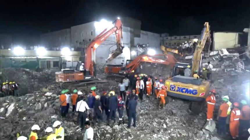 At least seven people have died and several others are feared trapped after a five-story building collapsed in Surat, Gujarat